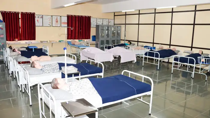 Nursing foundation lab with practice manikins lying on hospital beds